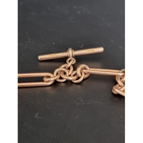 532 - An Edwardian yellow metal trombone link double Albert chain, each link stamped '9 375', 38cm long.... 