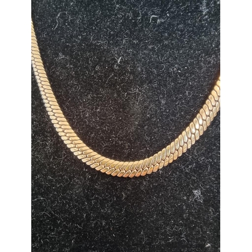 540 - A 9ct gold herringbone necklace, 46cm, 15g.