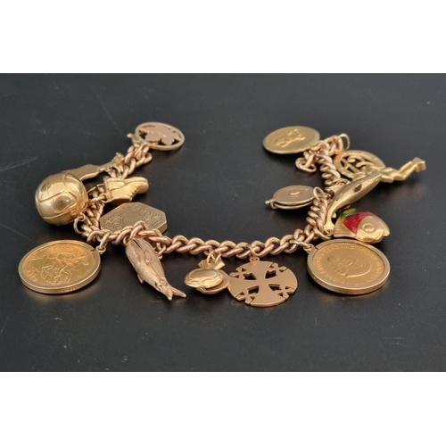 544 - A 9ct gold curb link charm bracelet, with fourteen attached 9ct gold charms; an Edward VII 1910 gold... 