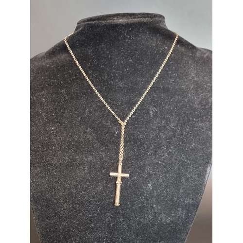 547 - A novelty crucifix form miniature propelling pencil pendant, 37mm, on a chain stamped 9ct.... 