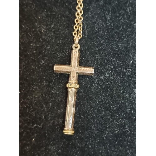 547 - A novelty crucifix form miniature propelling pencil pendant, 37mm, on a chain stamped 9ct.... 