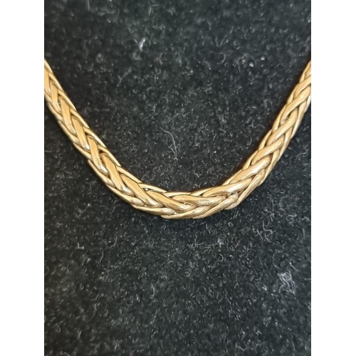 549 - A yellow metal woven graduated necklace, stamped 9ct, 44.5cm.