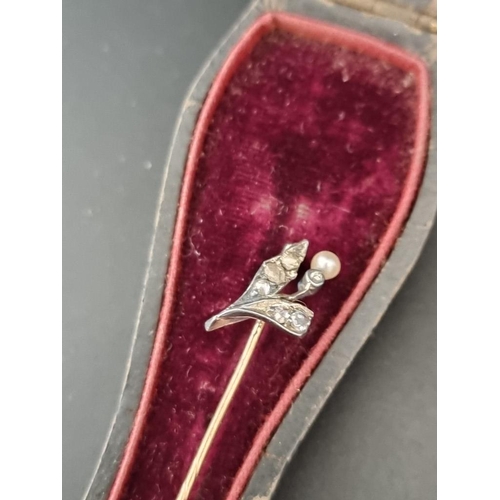 555A - A 19th century stick pin, set six diamond chips and a single pearl, 5.3cm, in a fitted case; togethe... 