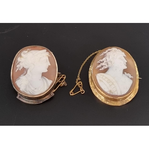 557 - A yellow metal carved shell cameo, in a yellow metal mount, 46mm high; together with another similar... 