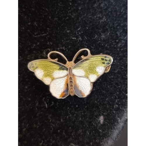 569 - A Norwegian white metal and enamel butterfly brooch, stamped 'Sterling', 24mm.