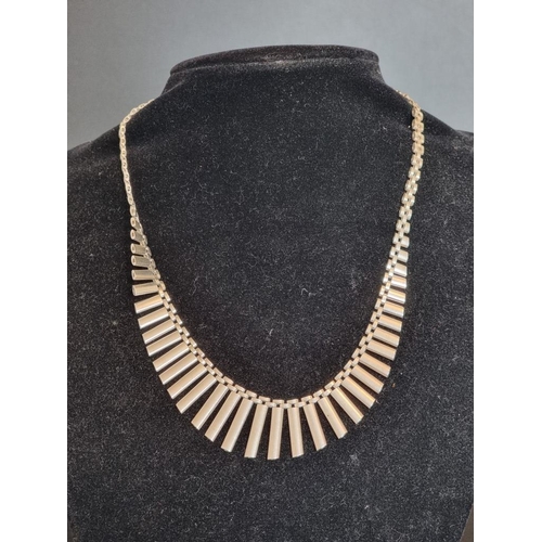 571 - A silver fringe necklace, import mark N K, London 1977, 43.3cm, 31g.