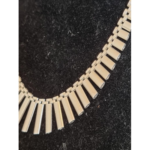 571 - A silver fringe necklace, import mark N K, London 1977, 43.3cm, 31g.