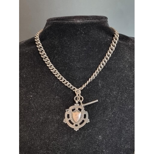 578 - A silver double Albert chain, with an attached silver pendant and silver swivel, 35cm.... 