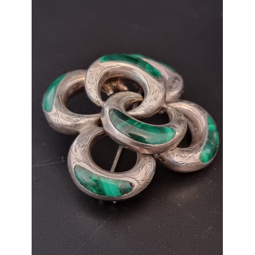 580 - A silver gilt hinged bangle, 20g; together with a Victorian malachite inset white metal knot brooch;... 