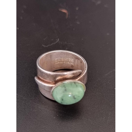 583 - A Norwegian white metal ring, set oval cabochon green agate, by David Andersen, stamped '925', size ... 