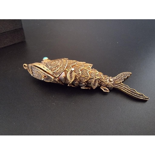 597 - A Chinese articulated silver gilt and fish pendant, having turquoise set eyes, 7cm, boxed.... 