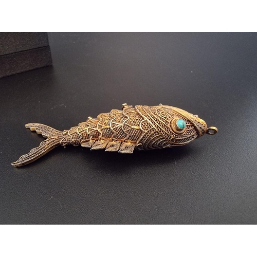 597 - A Chinese articulated silver gilt and fish pendant, having turquoise set eyes, 7cm, boxed.... 