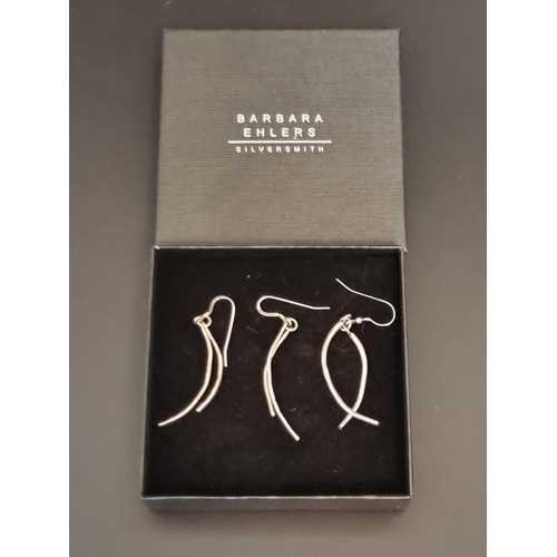 599 - A pair of contemporary silver 'double curve' pendant earrings, by Barbara Ehlers, London 2006, boxed... 