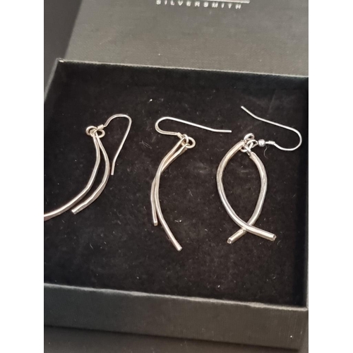 599 - A pair of contemporary silver 'double curve' pendant earrings, by Barbara Ehlers, London 2006, boxed... 