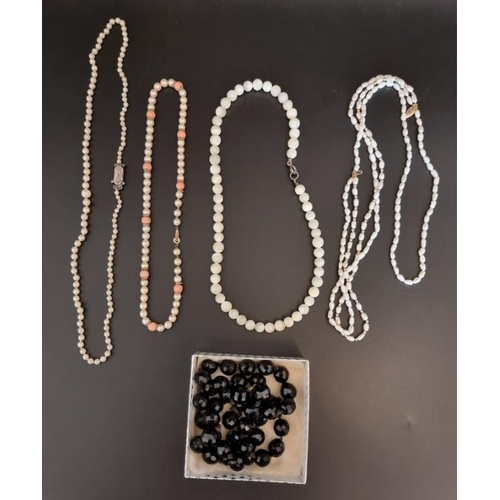 604 - A Victorian facetted bead jet necklace, 65cm.; together with four other necklaces.