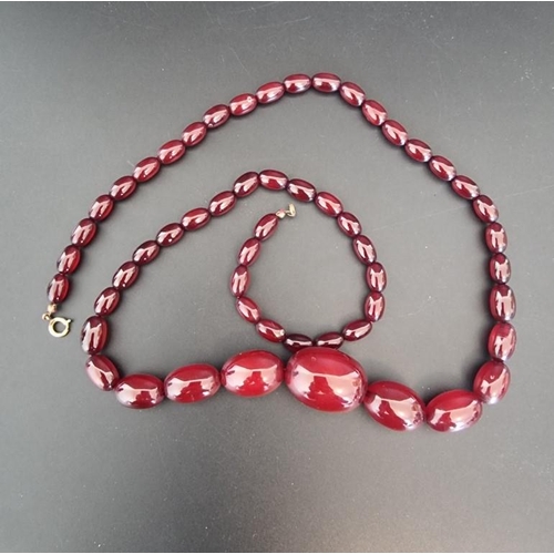 611 - A cherry amber graduated bead necklace, 77cm, 58g.