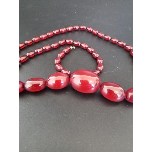 611 - A cherry amber graduated bead necklace, 77cm, 58g.