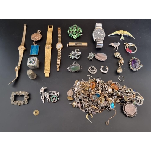 613 - A quantity of costume jewellery and watches.