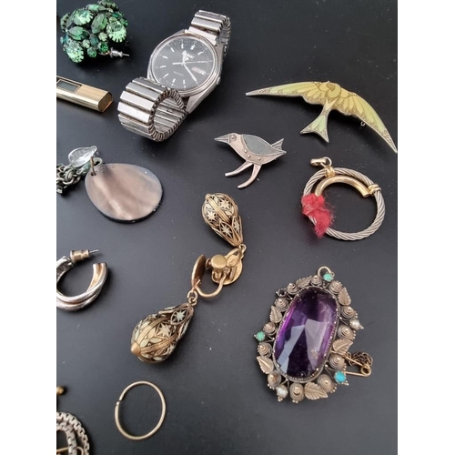 613 - A quantity of costume jewellery and watches.