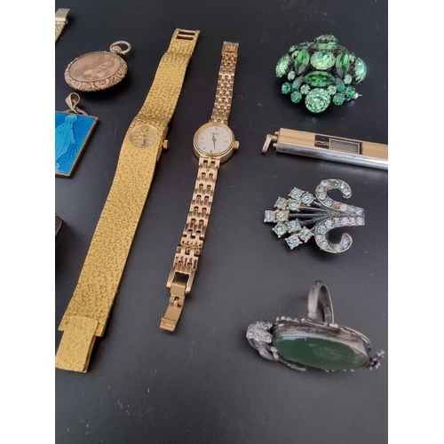 613 - A quantity of costume jewellery and watches.