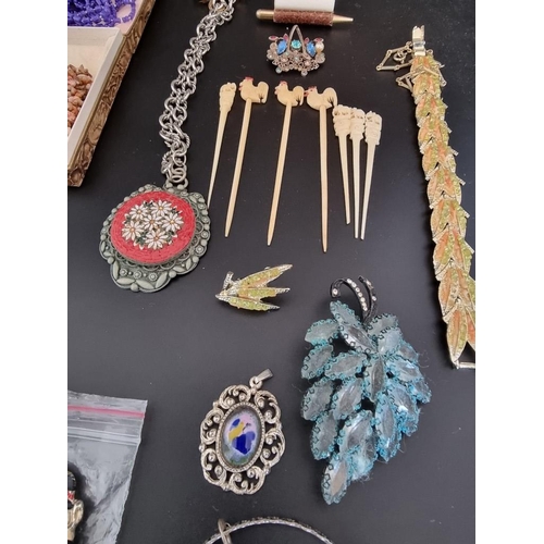 634 - A quantity of costume jewellery, watches and other items.