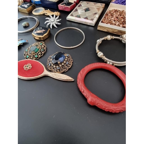 634 - A quantity of costume jewellery, watches and other items.