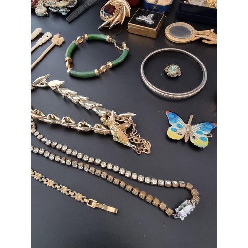 634 - A quantity of costume jewellery, watches and other items.