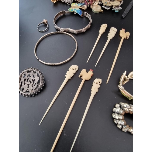 634 - A quantity of costume jewellery, watches and other items.