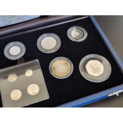 65 - Coins: a 2006 Royal Mint 'The Queen's 80th Birthday Collection', containing thirteen coins, to inclu... 