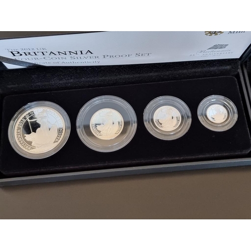 67 - Coins: a 2011 Royal Mint 'Silver Proof Britannia Collection' containing four coins, 20p to £2, with ... 