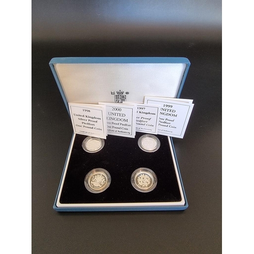 76 - Coins: a Royal Mint silver proof 'Piedfort One Pound Collection; containing four coins dated 1997-20... 