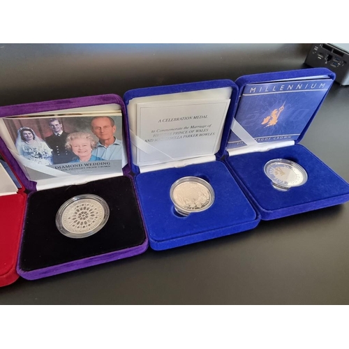 84 - Coins: five Royal Mint silver proof crowns; to include a Prince Harry 21st Birthday example and a 20... 