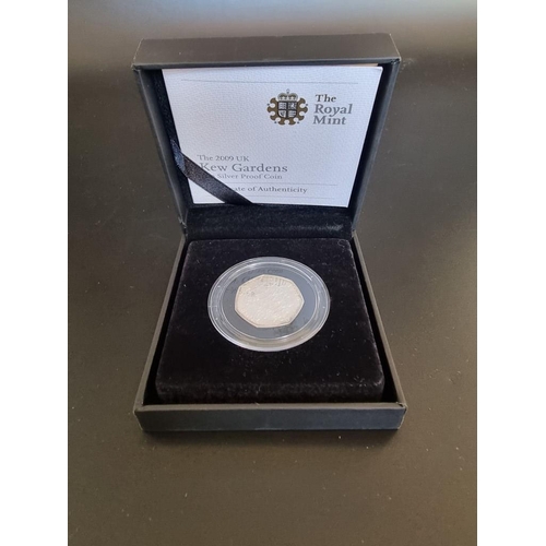 97 - Coins: a 2009 Royal Mint 'Kew Gardens' silver proof 50p coin, with CoA, boxed.