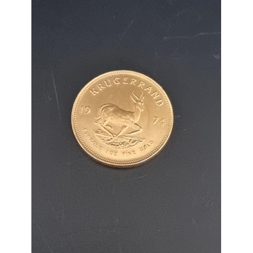 1A - Coins: a 1974 gold krugerrand.