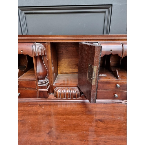 1067 - Au unusual reproduction carved mahogany desk, 103.5cm wide.