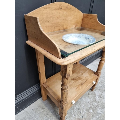 1000 - A Victorian pine washstand, 72cm wide; with associated Victorian blue and white pottery bowl. ... 