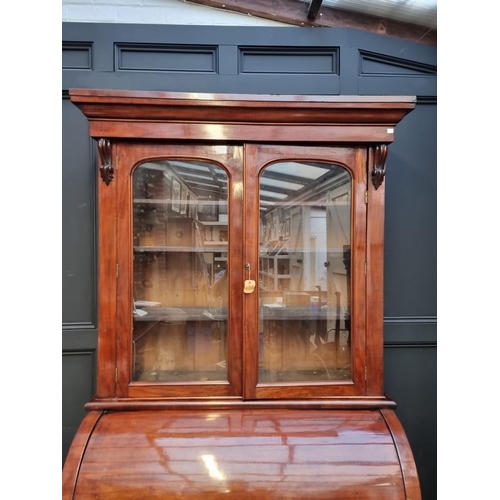 1002 - A Victorian mahogany cylinder bureau bookcase, with sliding and ratcheted surface, 117cm wide. ... 