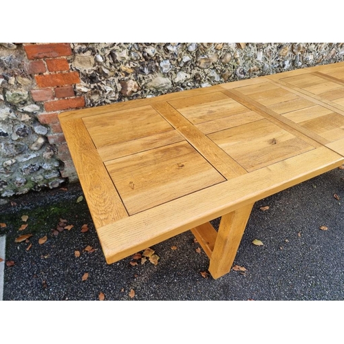 1009 - A contemporary pale oak drawleaf dining table, with two small extensions, 280cm extended.... 