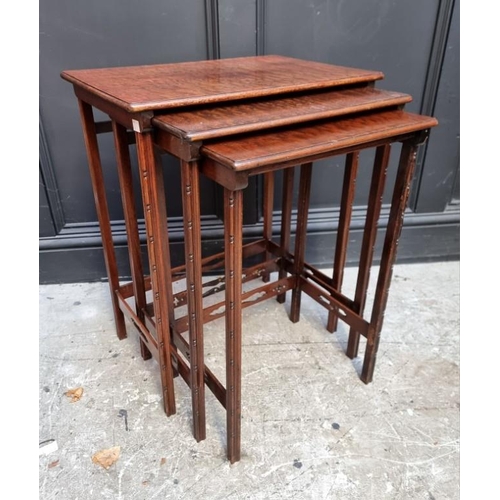 1017 - A small reproduction mahogany two tier occasional table, 34.5cm wide; together with a nest of three ... 