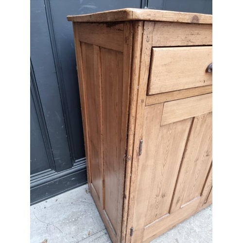 1020 - An antique pine side cabinet, 112.5cm wide.  