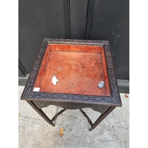 1034 - A small late Victorian carved mahogany square bijouterie table, with blind fret decoration, 39.... 