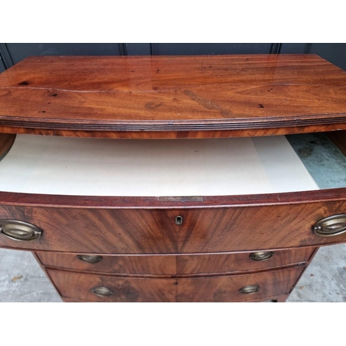 1036 - An early 19th century mahogany bowfront chest of drawers, 106cm wide, (splits to top).... 