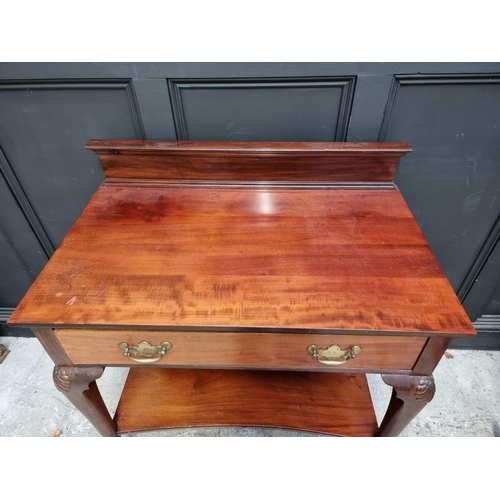 1045 - An early 20th century mahogany serving table, labelled 'Maple & Co', 91.5cm wide.... 