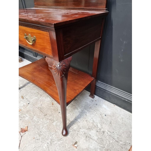 1045 - An early 20th century mahogany serving table, labelled 'Maple & Co', 91.5cm wide.... 