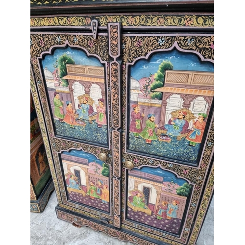 1053 - A decorative pair of Indian painted side cabinets, 65.5cm wide.