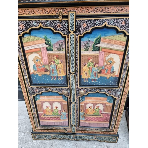 1053 - A decorative pair of Indian painted side cabinets, 65.5cm wide.