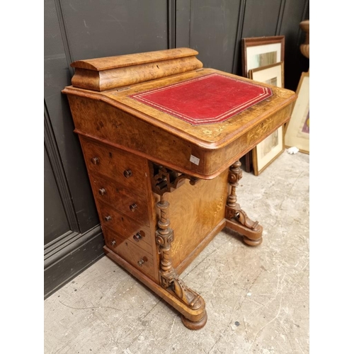 1064 - A Victorian walnut and inlaid Davenport, 54.5cm wide. 