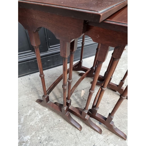 1069 - A nest of three mahogany occasional tables, largest 48cm wide. 