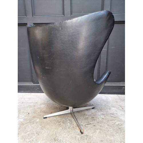 1076 - An early Arne Jacobsen black leather 'Egg' chair, probably by Fritz Hansen, model no.3317.... 