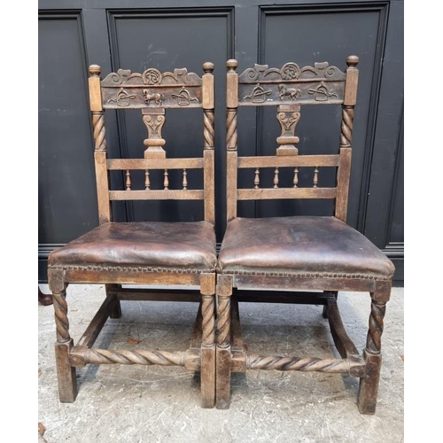 1079 - An unusual pair of Victorian carved oak side chairs, the backs carved with a horse, stirrups and oth... 